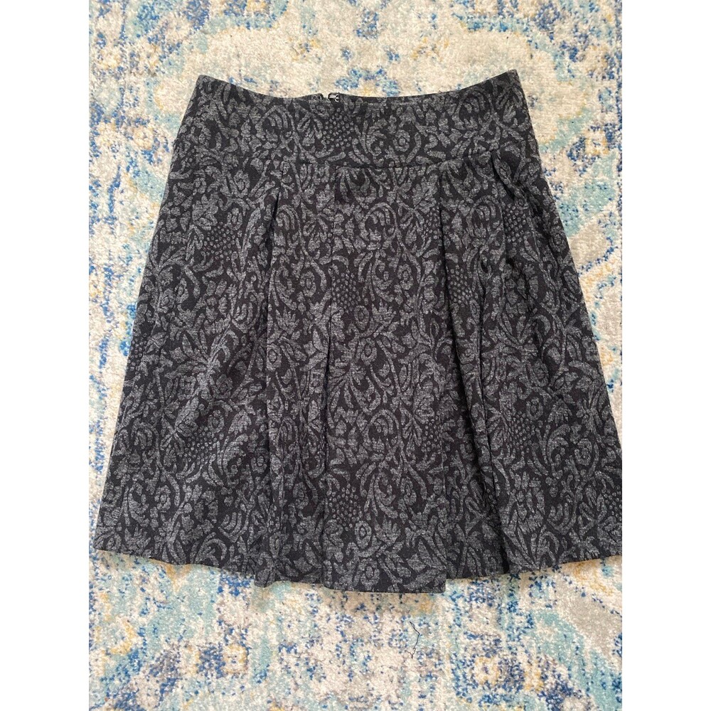 Black pleated knee length skirt